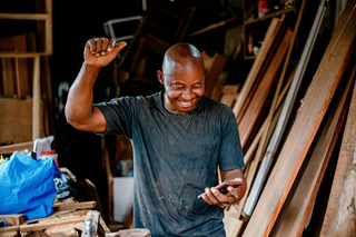 A man, happy with tracking customers.